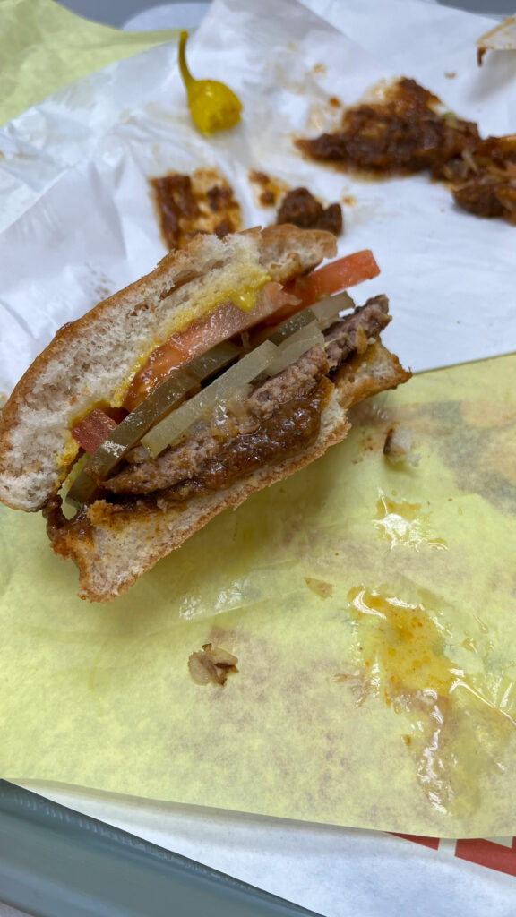 A partially eaten chili burger from Tommy's (It didn't take long before it was fully eaten)