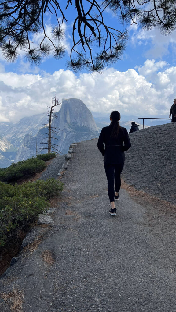 A view of Half Dome and my backside from Glacier Point in Yosemite National Park