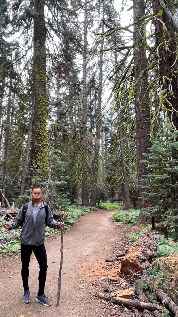 My guy goofing around on Taft Point Trail in Yosemite National Park. He found that stick on the side of the trail and made it his walking stick, not that he needed a walking stick. He said, "It's always good to have a stick with you because you never know what's going to attack you out there."