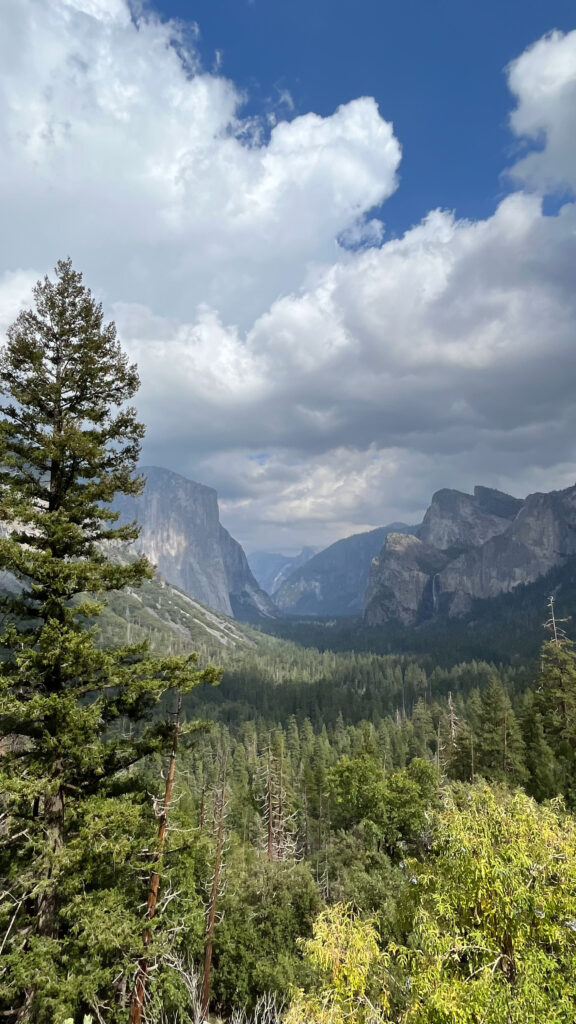 El Capitan on the left, Half Dome in the distance and Bridal Veil Fall near the right (seen from Tunnel View at Yosemite National Park)