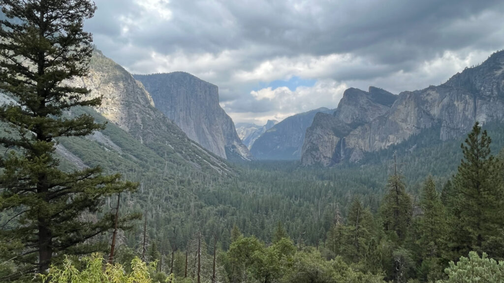 El Capitan on the left, Half Dome in the distance in the center and Bridal Veil Fall slightly right of the center of the photo (seen from Tunnel View at Yosemite National Park)