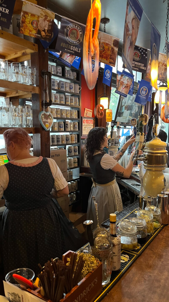 The bar and bartenders at Prost! in Portland, OR (All of the employees and some of the customers dress in traditional German attire)