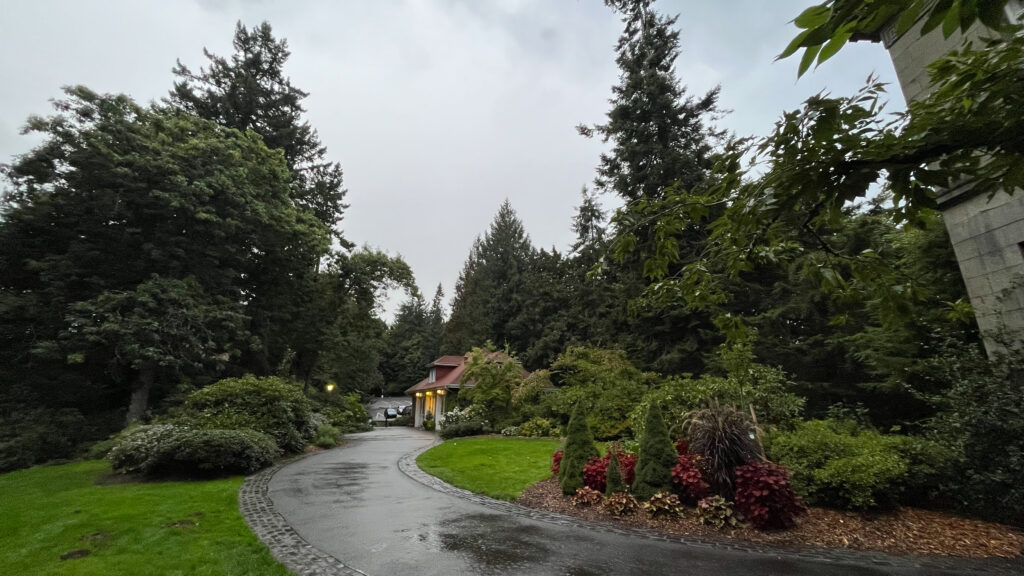 The grounds of Pittock Mansion with The Gate Lodge in the distance (Portland, OR)