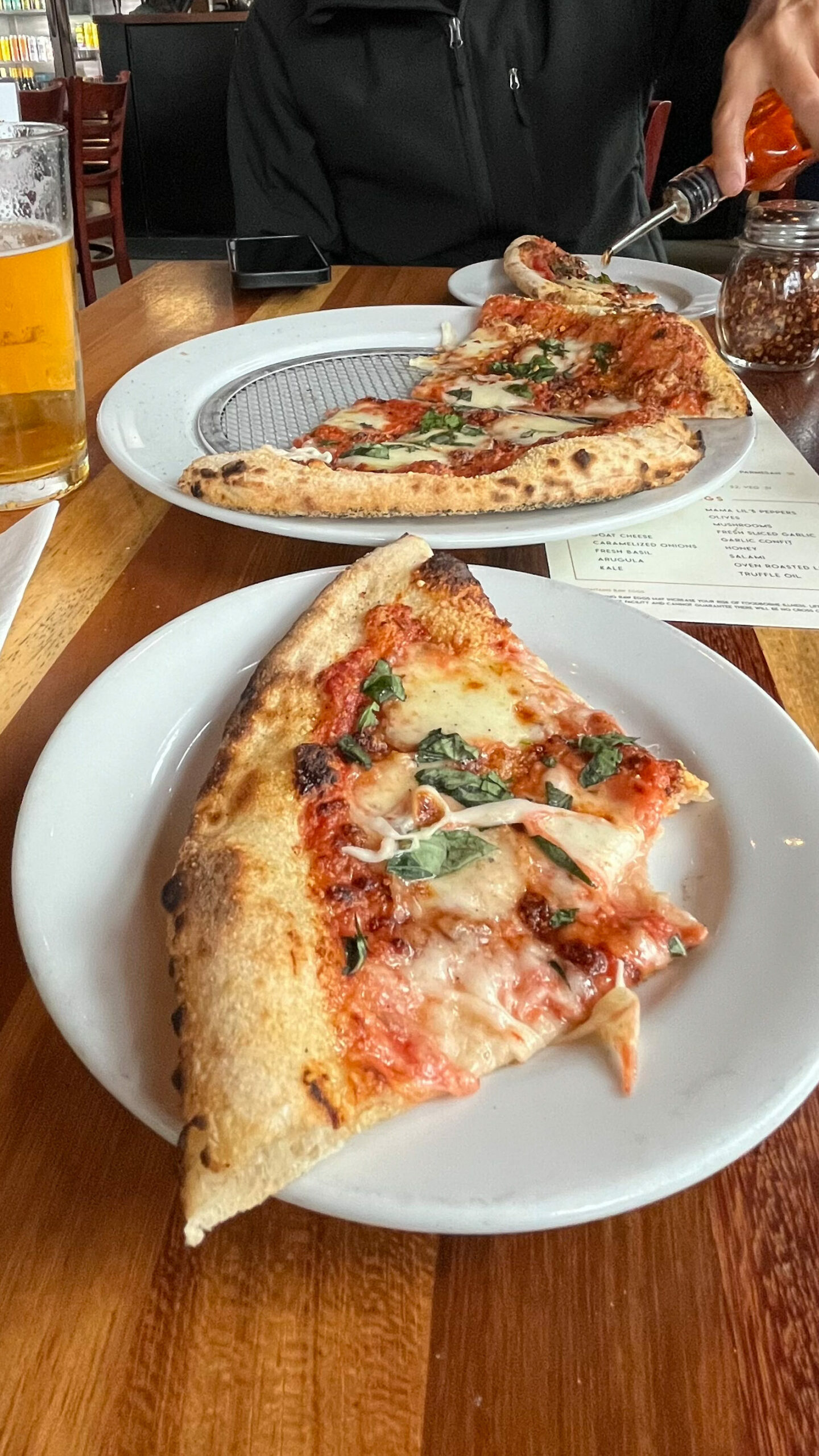 Life of Pie Pizza in Portland, OR serves excellent pizza and they have a great happy hour deal (they also have good beer) We both liked the taste of their chili oil drizzled onto our pizza