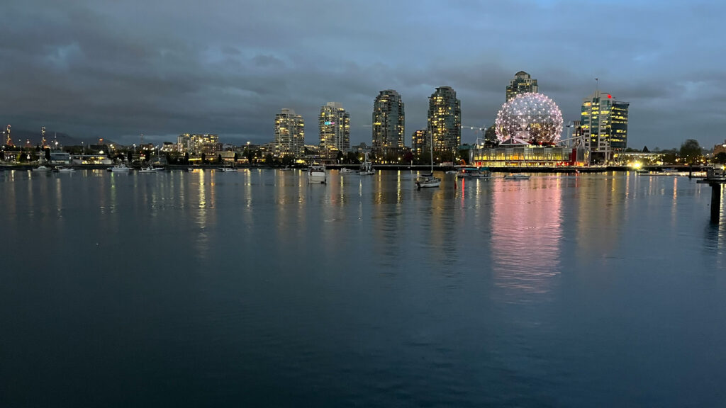 Science World lit up on the right as seen from The Seawall in Hinge Park (in Olympic Village in Vancouver, BC, Canada)