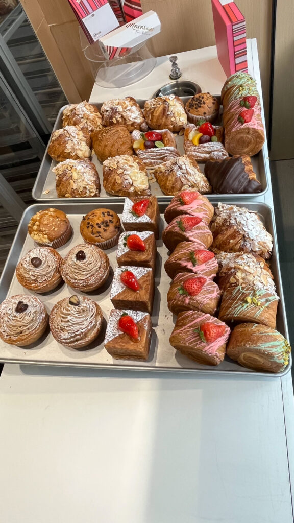 Yummy looking pastries in the window of FORÊT NOIRE PATISSERIE on Robson Street in Vancouver, BC, Canada