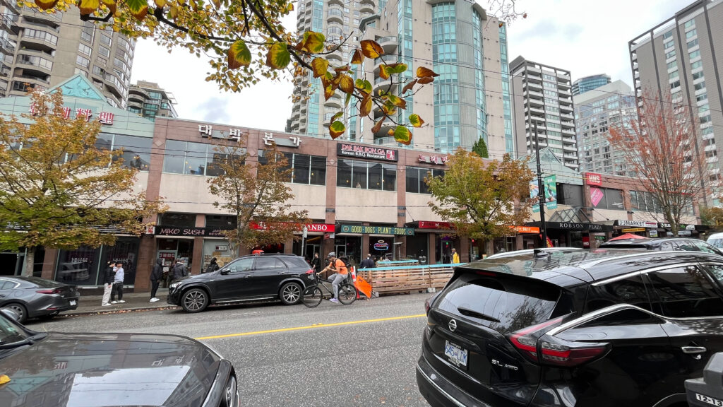 Another example of the many and diverse food establishments on Robson Street - the building shown has two levels with restaurants on both levels, some of which are The Dog House, Ramen DANBO, Dae Bak Bon Ga (Korean BBQ), Miko Sushi, JoongWon, and Bubble World (Taiwanese cuisine and bubble tea beverages) (Vancouver, BC, Canada)