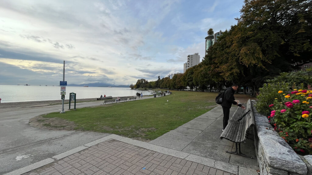 Here my husband was about to secure our Cinnamon Record pastry in our back to keep the loud, aggressive seagulls at English Bay from stealing it from his hands (Vancouver, BC, Canada)