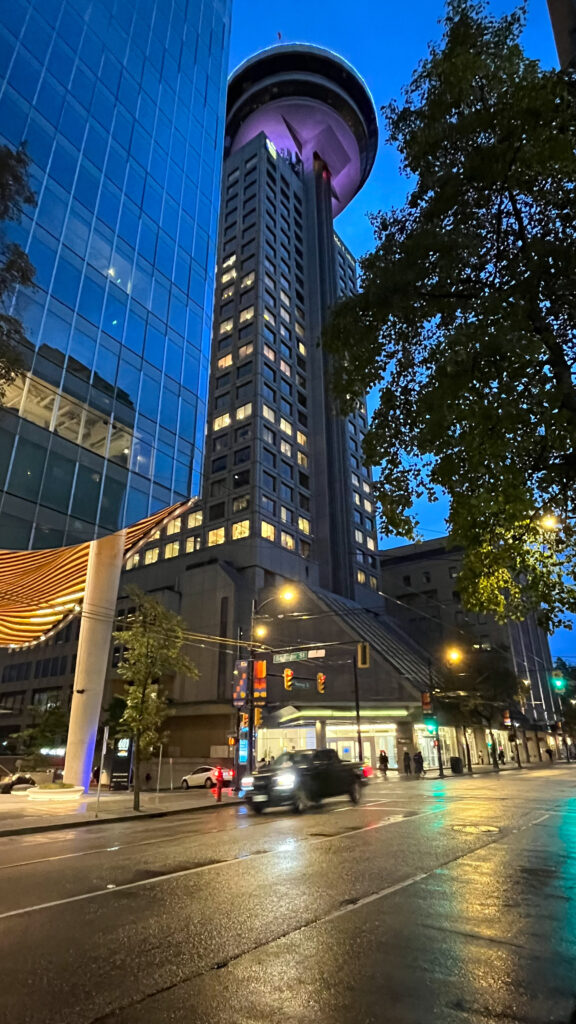 The Vancouver Lookout can be seen in the top center of this photo taken as we were walking northeast on Granville Street (Vancouver, BC, Canada)