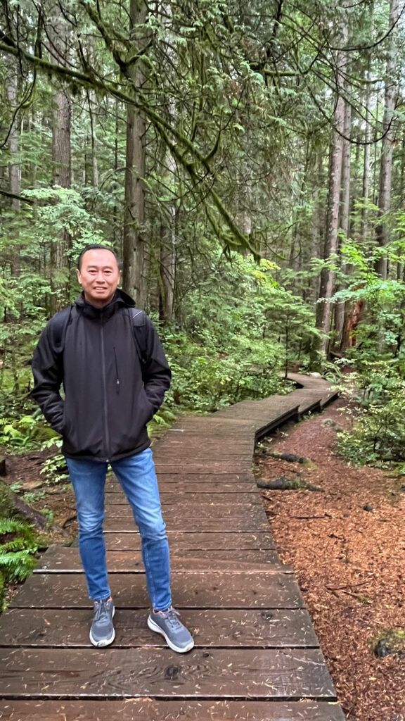 My husband enjoying our hike on Twin Falls trail (Lynn Canyon Park in North Vancouver, BC, Canada)