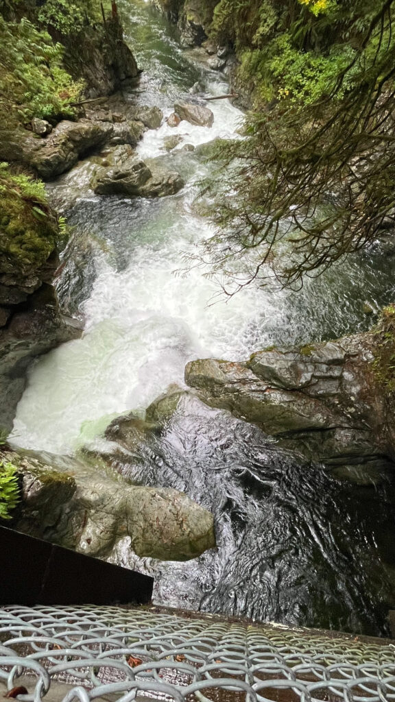 The view from the other side of the wooden bridge over the falls on Twin Falls trail (Lynn Canyon Park in North Vancouver, BC, Canada)