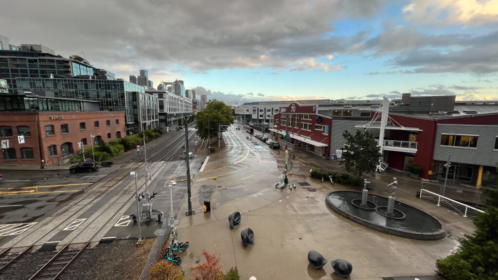 View of Alaskan Way from Olympic Sculpture Park. On the right side of the street are the piers with the walkway along Alaskan Way (Seattle Waterfront in Seattle, WA)