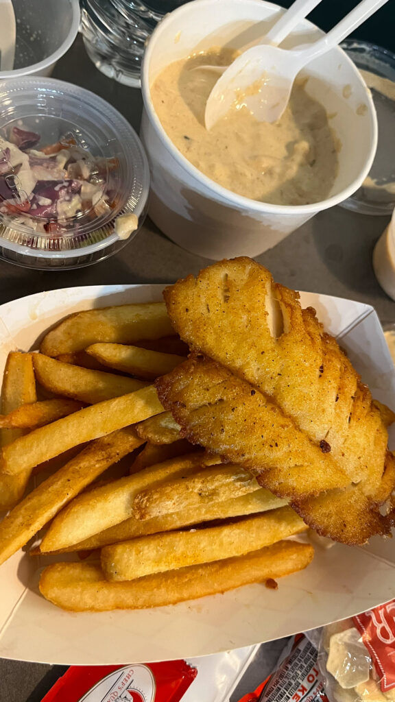 Our Alaskan cod & chips, coleslaw and salmon chowder at Emerald City Fish & Chips. We shared an order so they gave us an extra tray to put my food in (Seattle, WA)