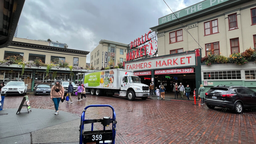 The famous Public Market Center Clock & Sign at the corner of Pike Street and Pike Place (Pike Place Market in Seattle, WA)