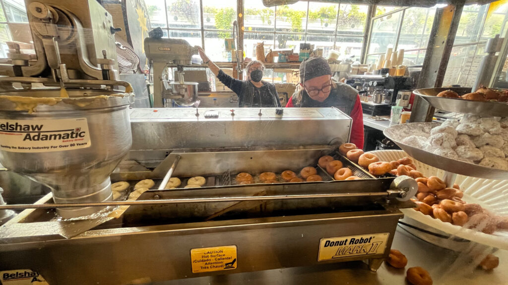 The doughnuts being made fresh at Daily Dozen Doughnut Company (Pike Place Market in Seattle, WA)