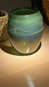 Green vase with yellow lines glass artwork at Chihuly Garden and Glass (Seattle, WA)