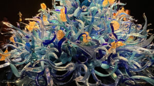 Shades of blue, aqua and yellow glass artwork of sea life and sea plant at Chihuly Garden and Glass (Seattle, WA)