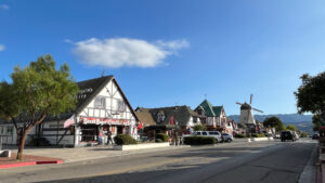 Danish style buildings in Solvang, CA with rolling hills in the distance