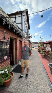 My husband standing in front of Viking Garden Restaurant in Solvang, CA