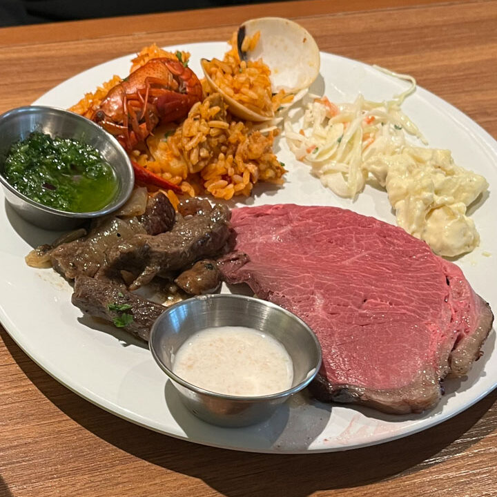 Plate of food including Prime Rib from Carnival Venezia Marketplace lunch buffet on Embarkation Day.