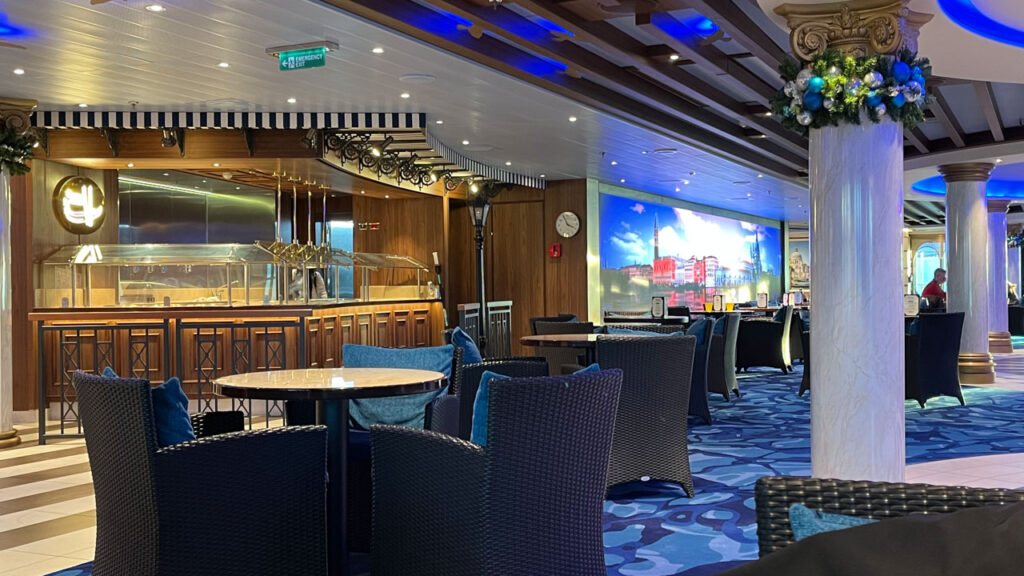 Carnival Venezia area where La Strada Grill lunch buffet eating area is located indoors - Promenade Deck midship (deck 5). You can see the LED video display of Venice in the center of the photo.