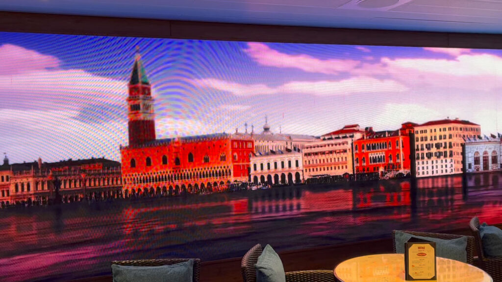 Carnival Venezia - Promenade Deck midship (deck 5). Photo of the LED video display of Venice.