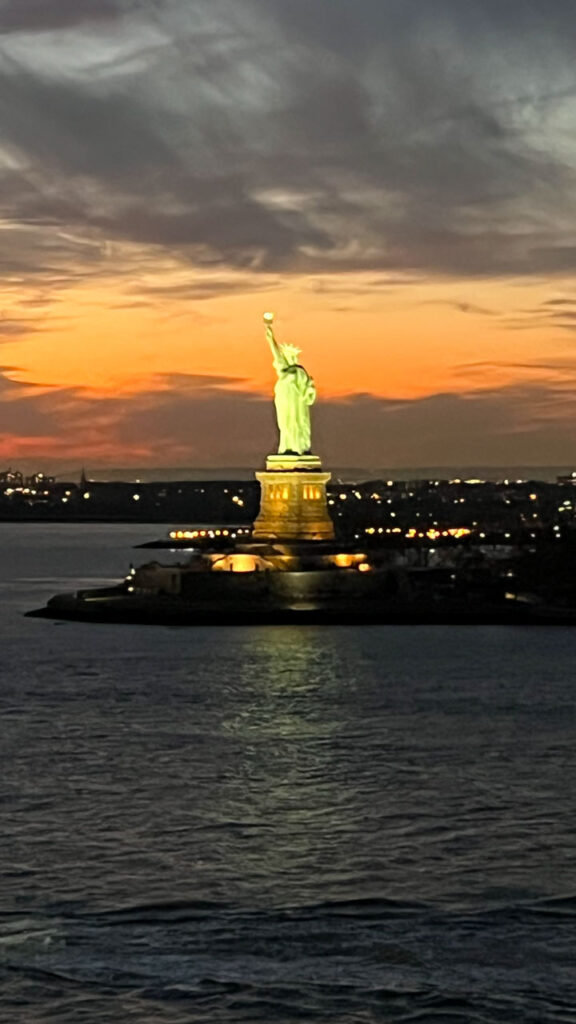 Sailing out of Manhattan, New York City, NY on the Carnival Venezia during sunset, as we were coming near the Statue of Liberty