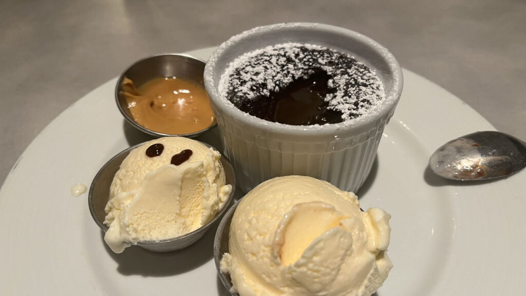 Carnival Melting Chocolate Cake for dinner dessert in the main dining room on the Carnval Venezia, served with a side of peanut butter and two scoops of vanilla ice cream