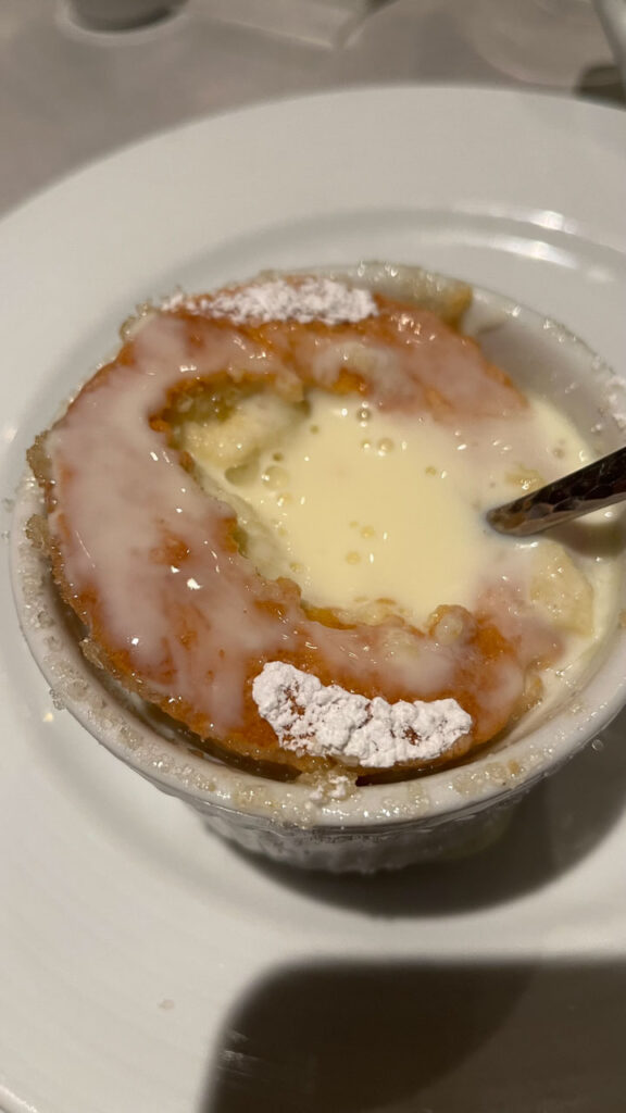 Grand Mariner Souffle with Orange Cream Anglaise in the Main Dining room at dinner time on the Carnival Venezia