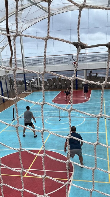 My husband playing pickleball on the Carnival Venezia