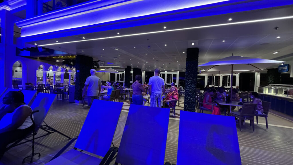 People enjoying the nice evening in Grand Turk on the Lido Deck on the Carnival Venezia