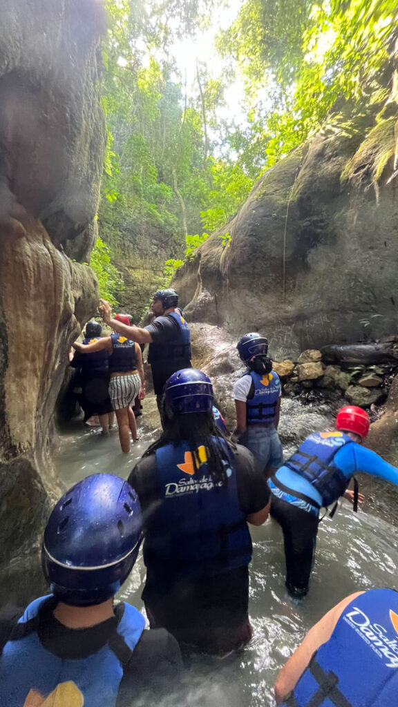 Onto the next "fall" - a slide into slightly cooler water (at Damajagua 27 Falls in the Dominican Republic)