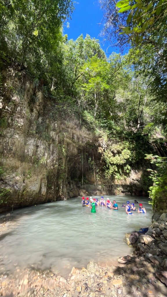 People waiting in another pool of water for the rest of our group to come down. We got out of the water because the lower we went, the colder the water was, and it was pretty cold at this point! (At Damajagua 27 Falls in the Dominican Republic)