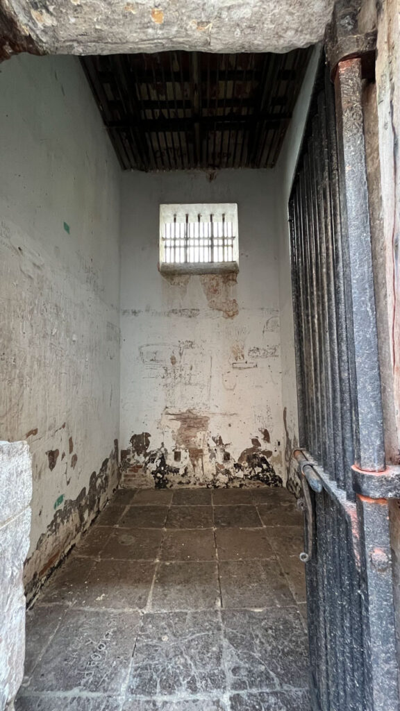 Inside one of the prison cells that are accessible from a narrow passage from the back patio of the Puerto Rico Tourism Company on Paseo de la Princesa in San Juan, Puerto Rico that you can tour for free