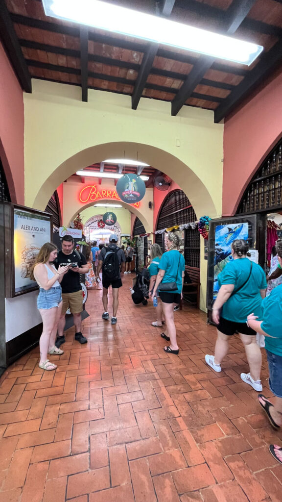 Then entrance to Barrachina where we tried their famous Pina Colada. The to-go line forms in this warm, stuffy corridor (In San Juan, Puerto Rico) (I just noticed that the couple on the left is in another one of my photos above at the fort)