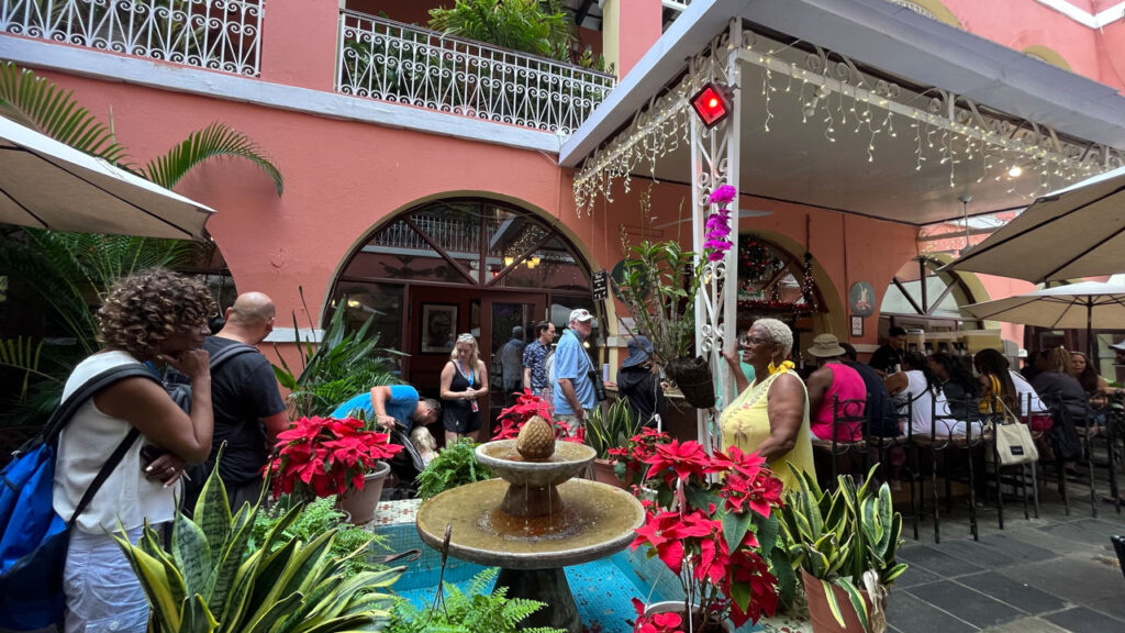 After waiting in line in the warm, stuffy corridor, they then let a number of people in at a time to wait in another line in the outside dining area for Barrachina (In San Juan, Puerto Rico) In all in took 16 minutes from the time we got in the first line until we got our Pina Colada