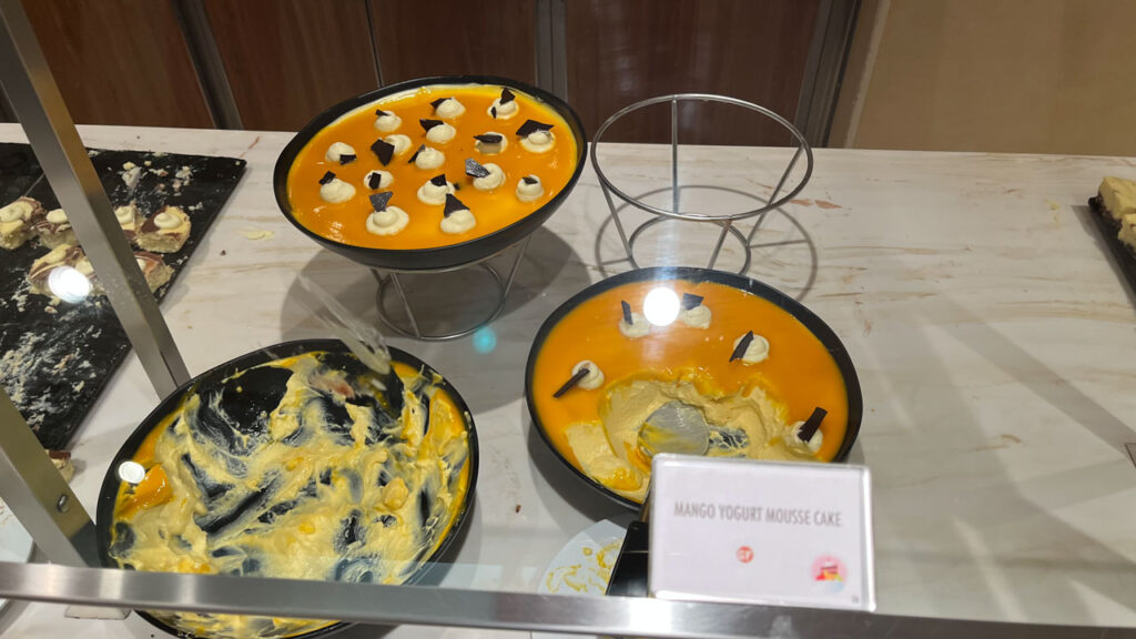 The Mango Yogurt Mousse Cake at the Sweet Spot at Lido Marketplace dinner buffet on the Carnival Venezia was exceptionally good. So, so yummy!