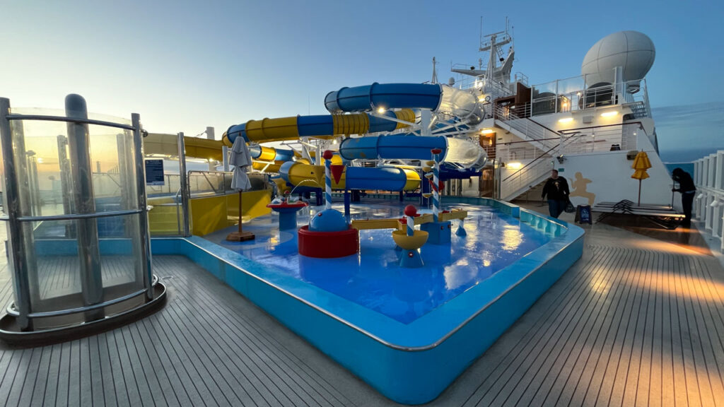 Carnival Waterworks on the Carnival Venezia. The yellow waterslide on the left is slow and boring, but the yellow and blue waterslide and the blue waterslide with clear sections on the right side of the photo are both fun and fast