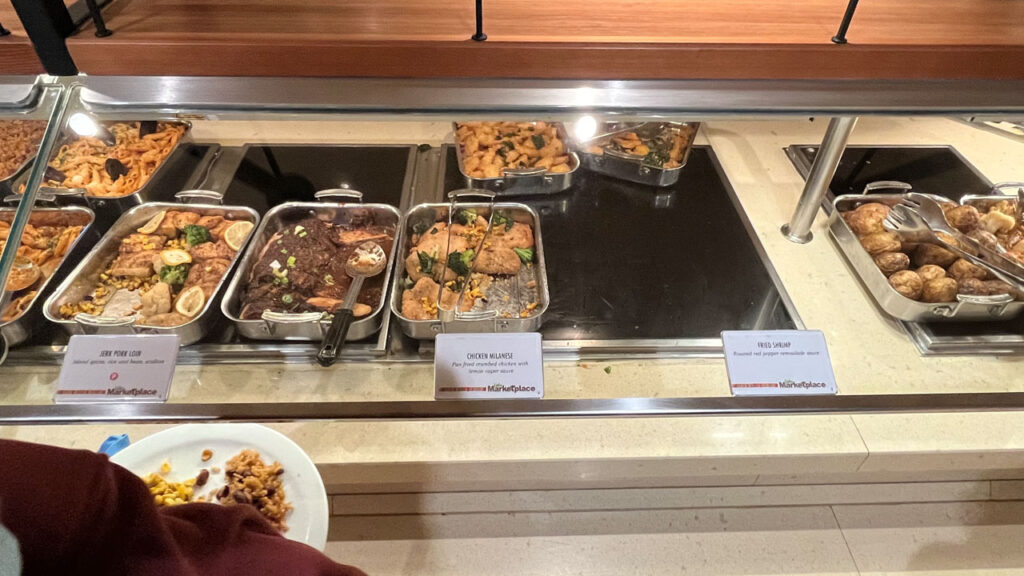 Jerk Pork Loin, Chicken Milanese and Fried Shrimp and other items at the Lido Marketplace dinner buffet on the Carnival Venezia